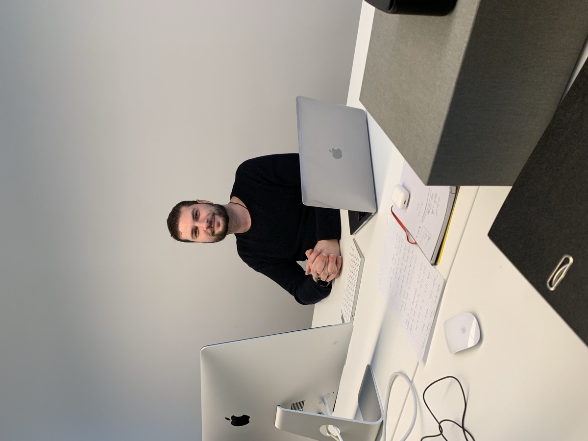 Nami Shams at his desk